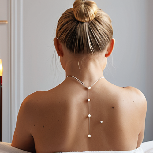 **A serene woman receiving acupuncture treatment in a modern Stockholm clinic. Focus on the gentle placement of needles in her back and shoulders, soft lighting, and a sense of relaxation. Include traditional Swedish design elements in the background.**